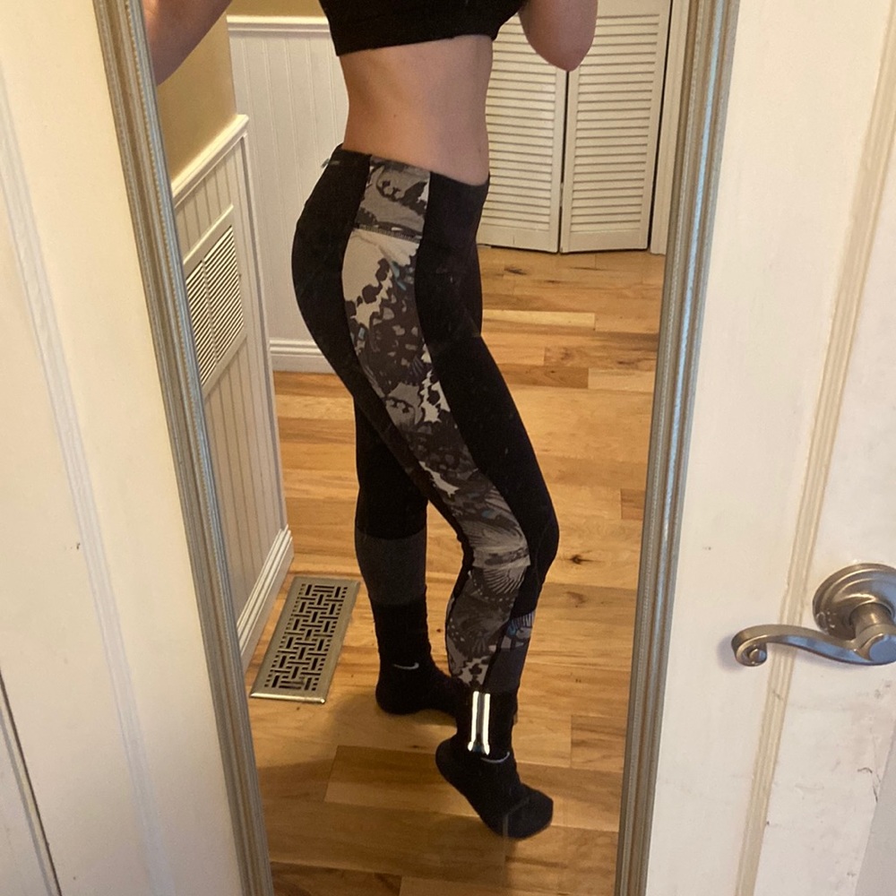 Lulu lemon leggings with butterfly detailing and reflective zippers on legs